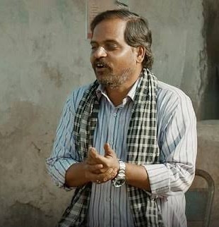 Banraksh from Panchayat, pointing at the statistic